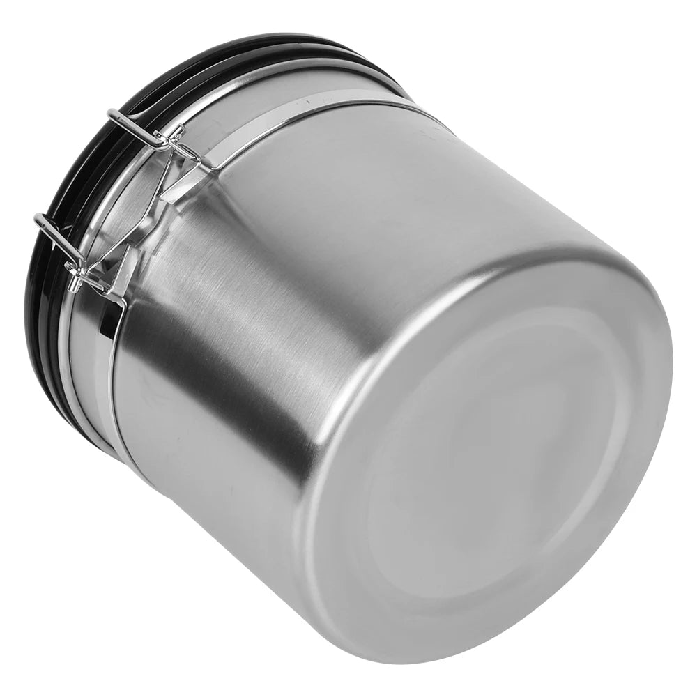 Stainless steel canister with black-rim lid and metal latch handle, side view