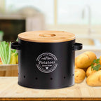 Black vented potato storage canister with bamboo lid on countertop with vegetables