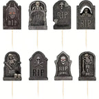 Black RIP tombstone cupcake toppers with skull and graveyard faces on picks