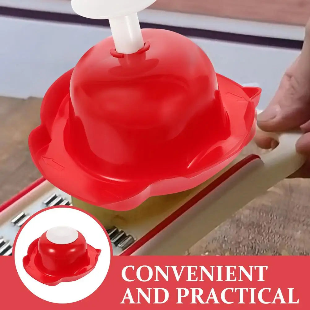 Red food safety slicer holder with finger guard shield being used on a grater