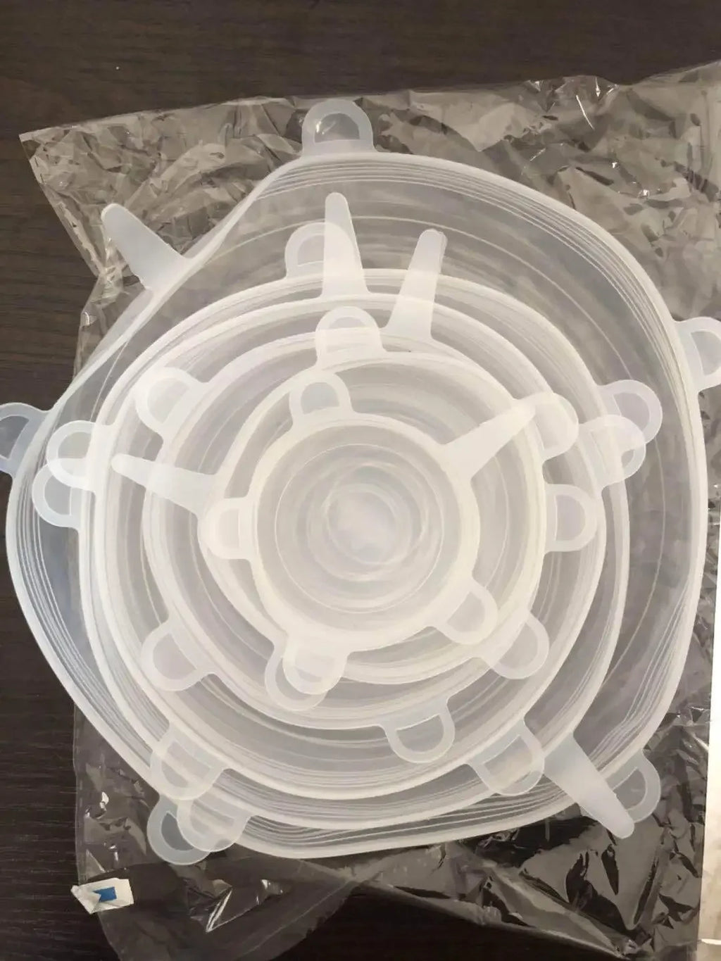 Clear silicone stretch lids stacked and packed in plastic bag