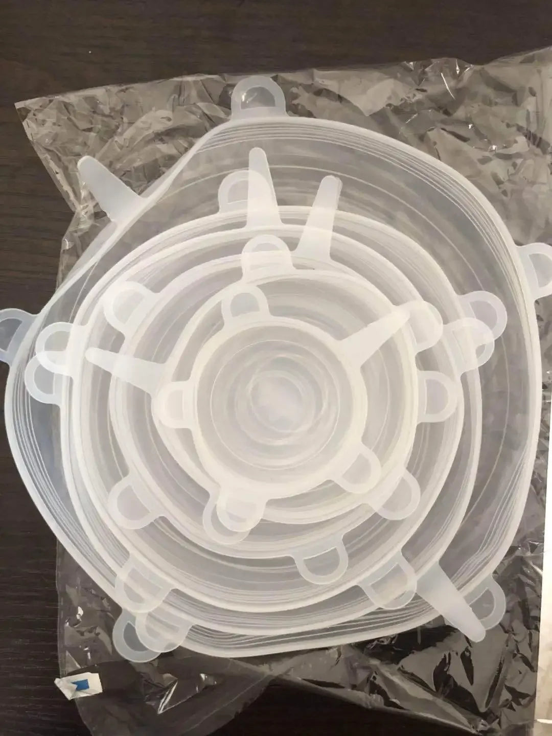 Clear silicone stretch lids stacked and packed in plastic bag