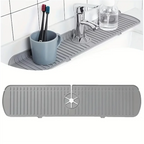 Gray silicone sink splash guard drain mat with toothbrush holder and molded grooves