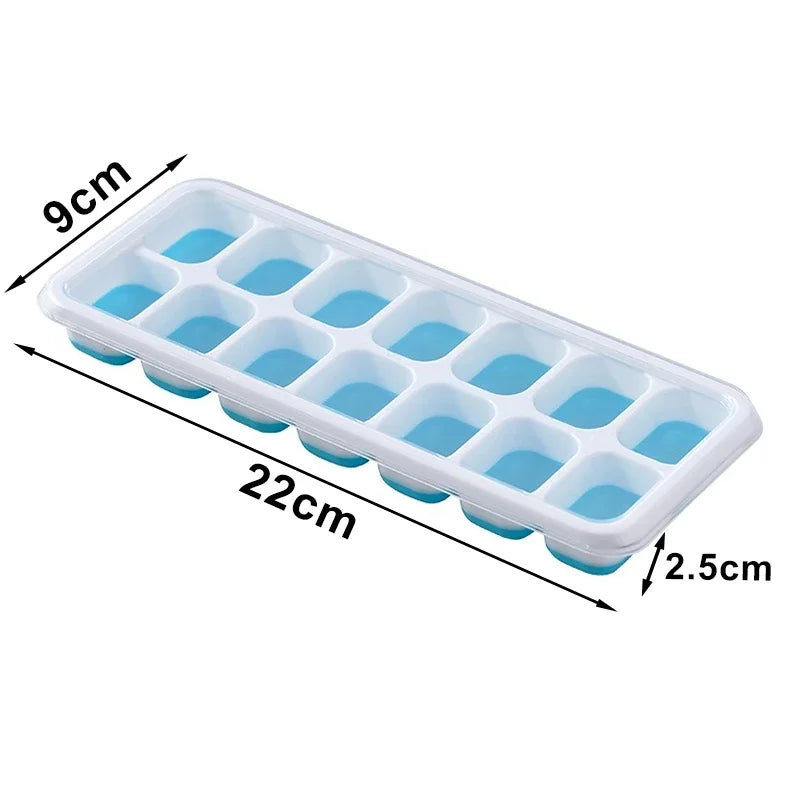 Rectangular ice cube tray with blue cavities and clear lid; 22 x 9 cm