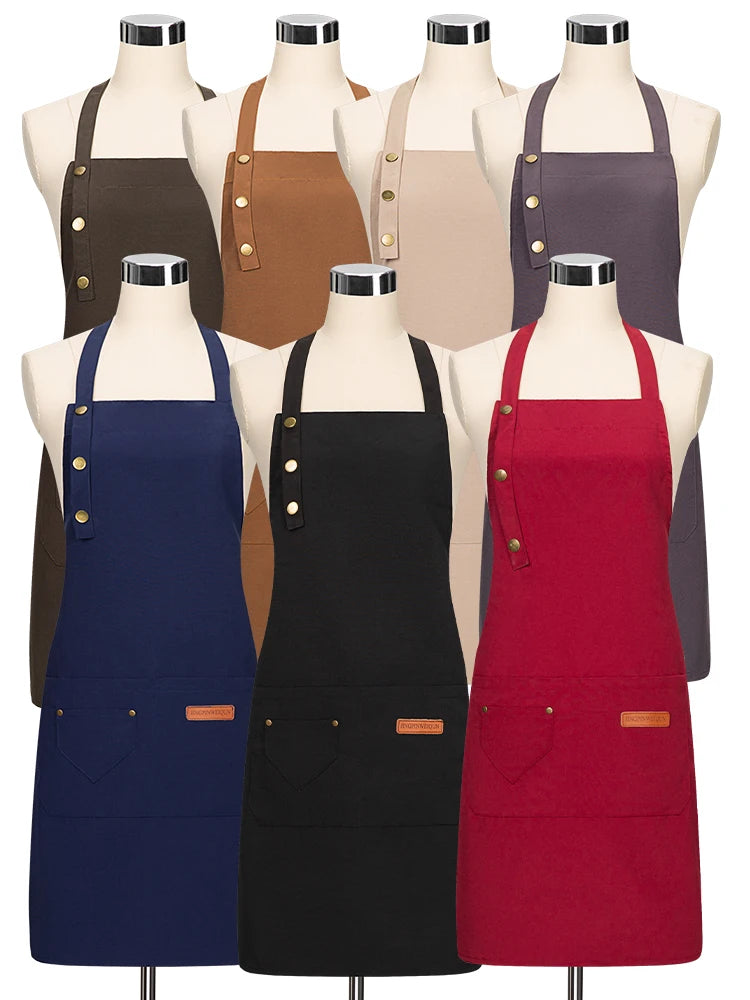 Assorted chef aprons on mannequins in red, navy, black, brown, and tan