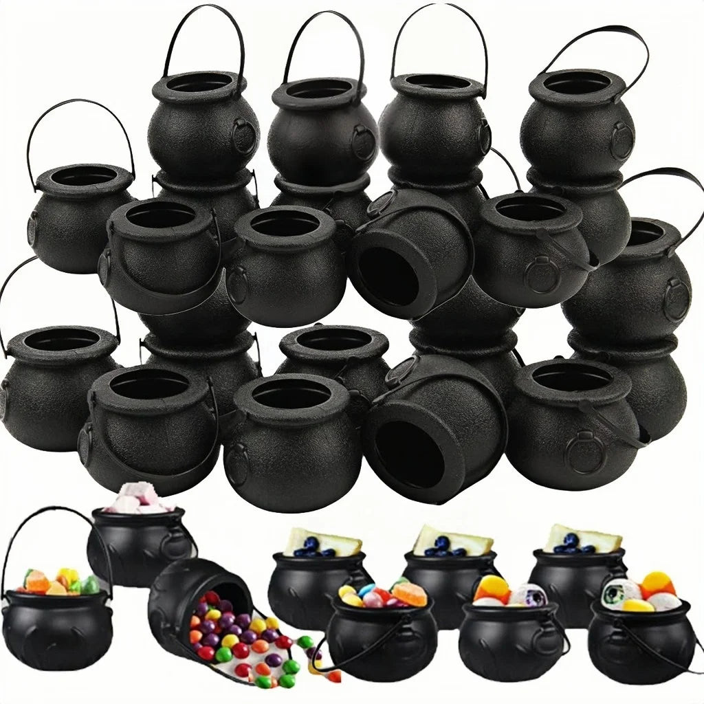 Set of black cauldron candy bowls with handles and round openings, textured finish