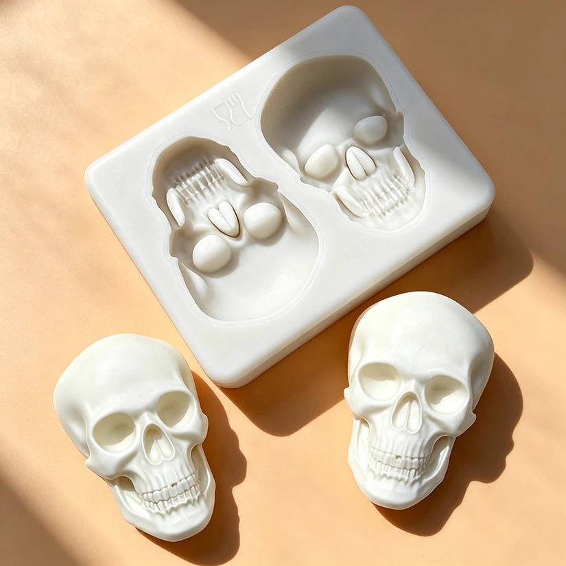 Skull silicone cake mold showing two skull shapes and separate molded skull pieces