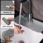 Gray silicone splash guard and drain mat with water running over molded channels
