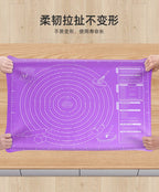 Purple silicone pastry mat held on countertop with concentric ring design