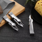 Stainless steel fruit hulling tweezers set with spare blade on wooden cutting board