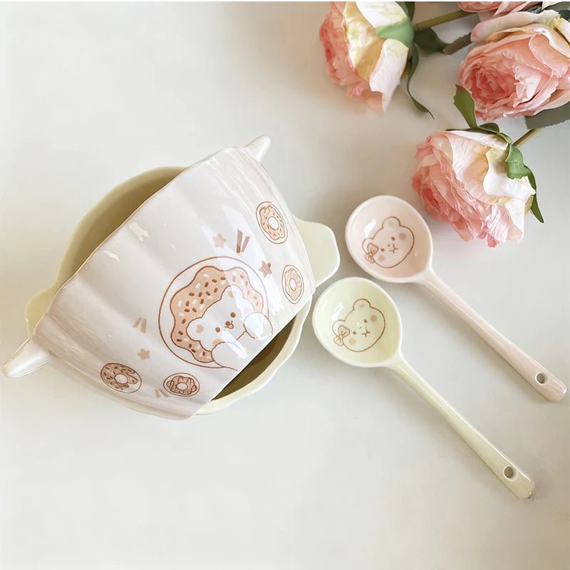 White ceramic bowl with spoon, cute bear illustration and star motifs