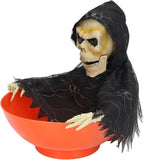 Orange skull bowl haunted prop with hooded skeleton face and side view of webbed poncho