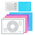 Assorted silicone baking mats with concentric ring patterns in blue, purple, and gray