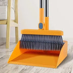 Household broom and dustpan set with orange dustpan and dark bristle broom head