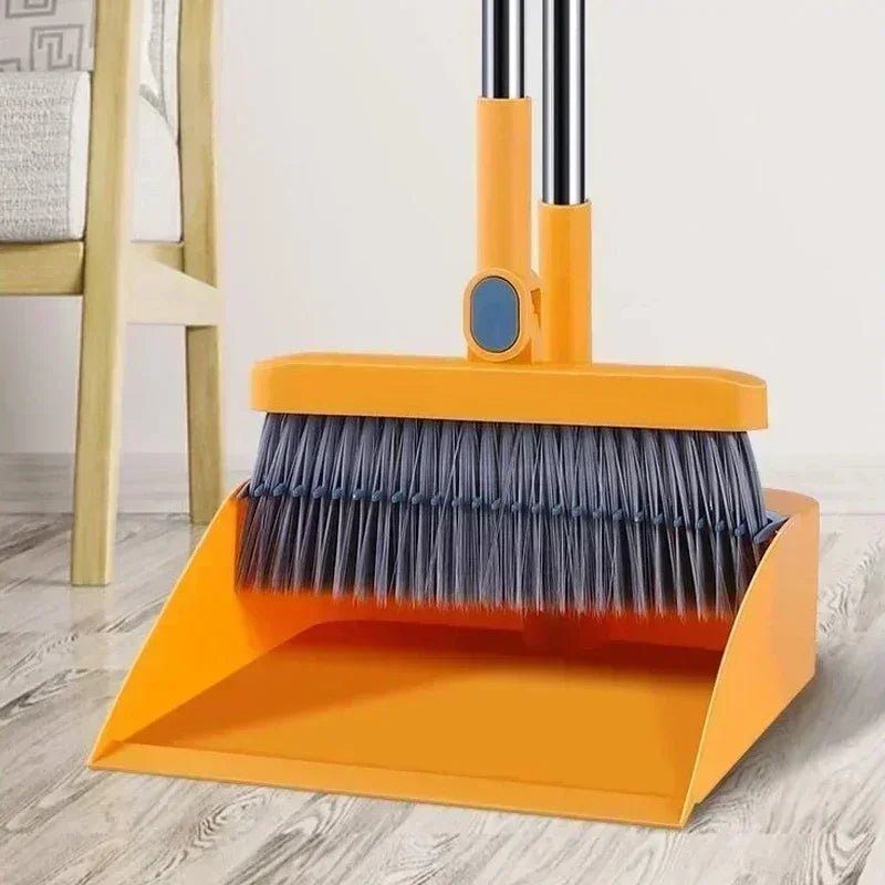 Household broom and dustpan set with orange dustpan and dark bristle broom head