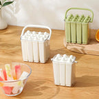 Set of silicone ice stick trays with molded popsicles in multiple colors
