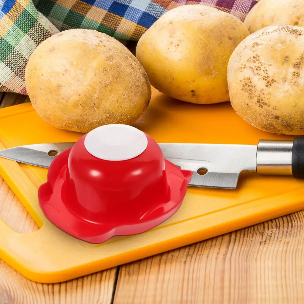 Red food safety slicer holder with finger guard shield on grater