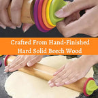 Hands rolling dough with a beech wood adjustable rolling pin and colorful ring set