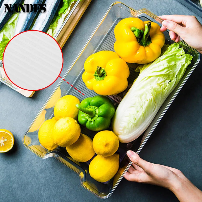 Clear storage bin with built-in handles for peppers, lettuce, lemons, and tomatoes
