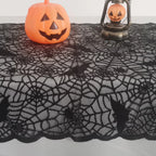 Black lace tablecloth with bat skull web pattern