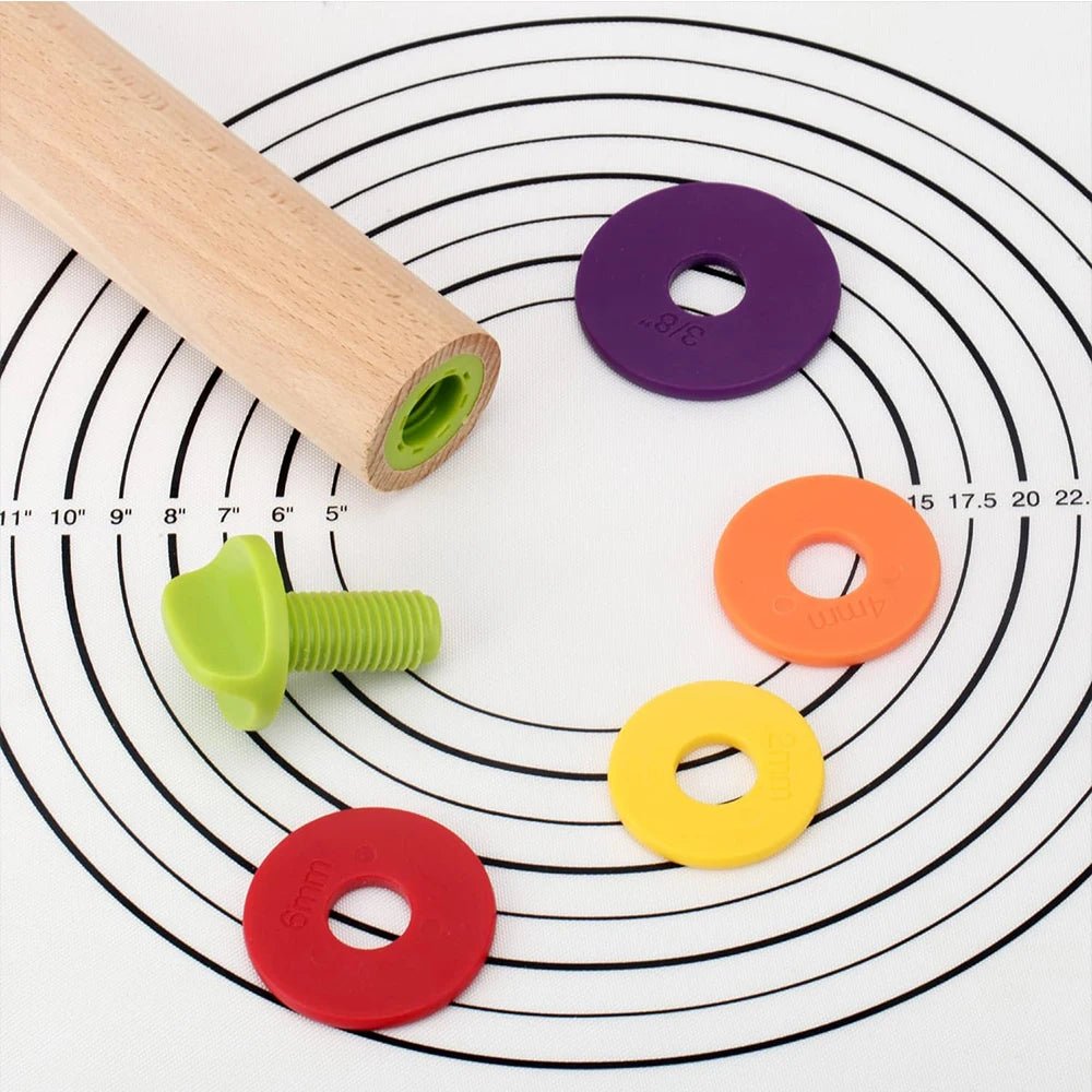 Beech rolling pin thickness rings on a patterned rolling mat surface