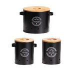 Vented black vegetable storage canister set: potatoes, onions, and garlic