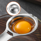 Stainless steel egg separator close-up with yolk cup and bowl rest hook