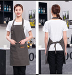 Olive green waterproof apron with adjustable neck; back view shows dark tie