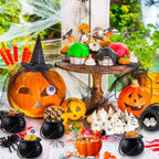 Black cauldron candy bowl with handle and round opening, textured finish for party treats