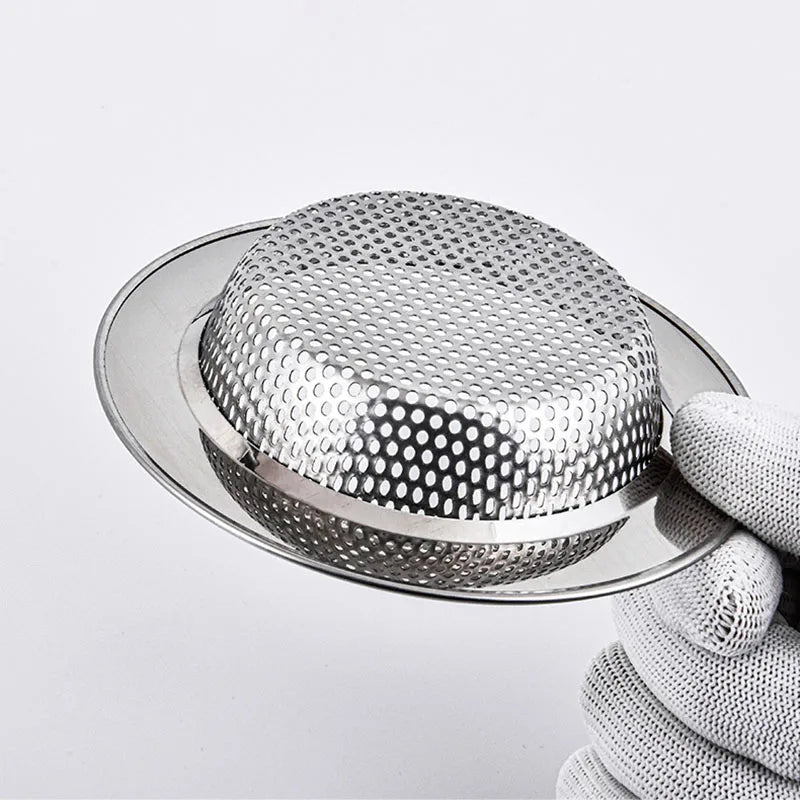 Stainless steel sink strainer basket with domed mesh, close-up on rim