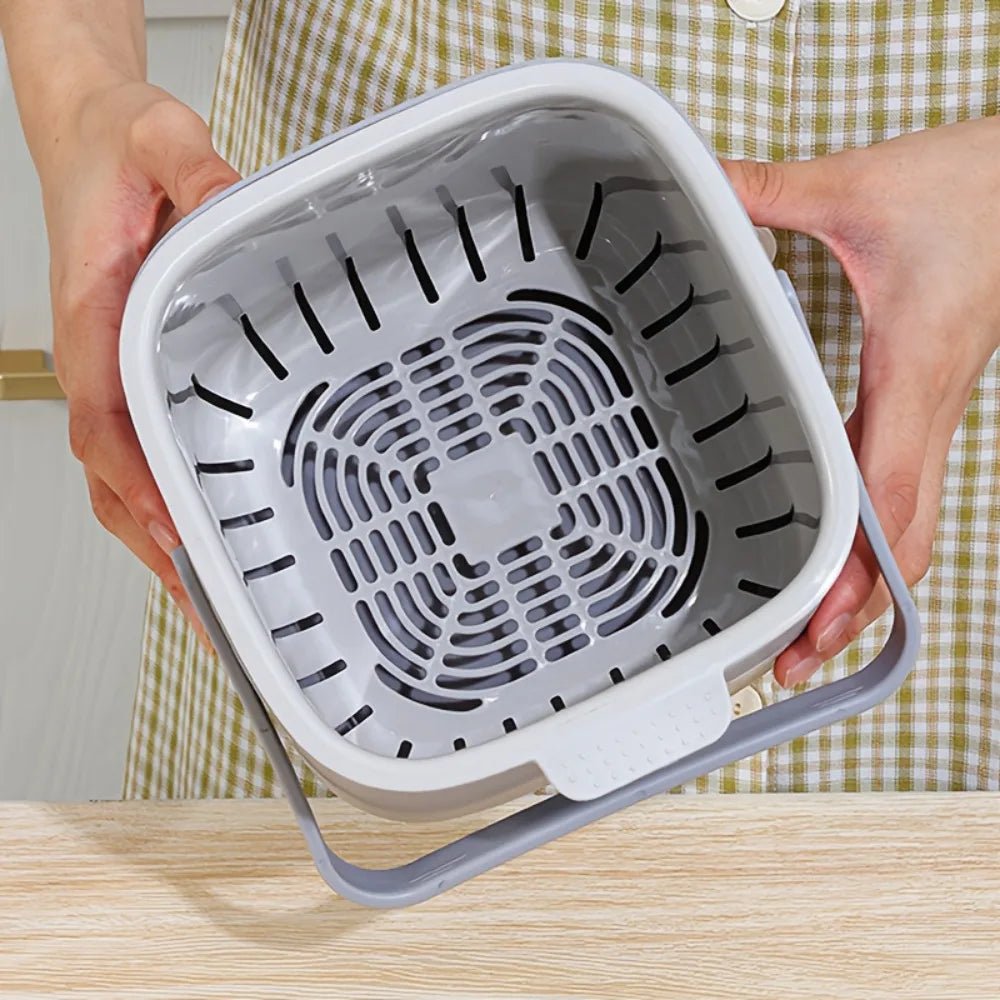 Open gray countertop compost bin showing vented inner drain tray