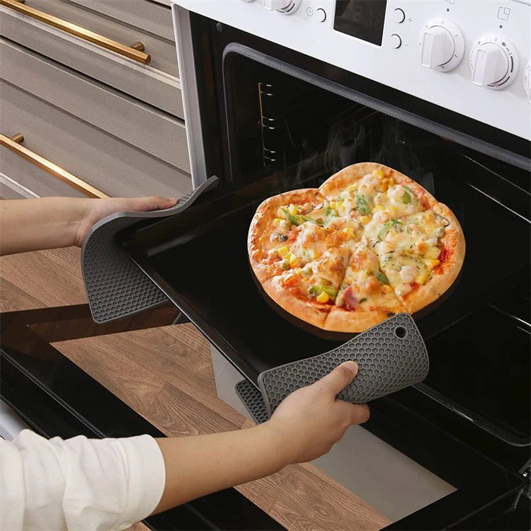 Black silicone hot pads with hex texture for safely handling hot cookware from the oven