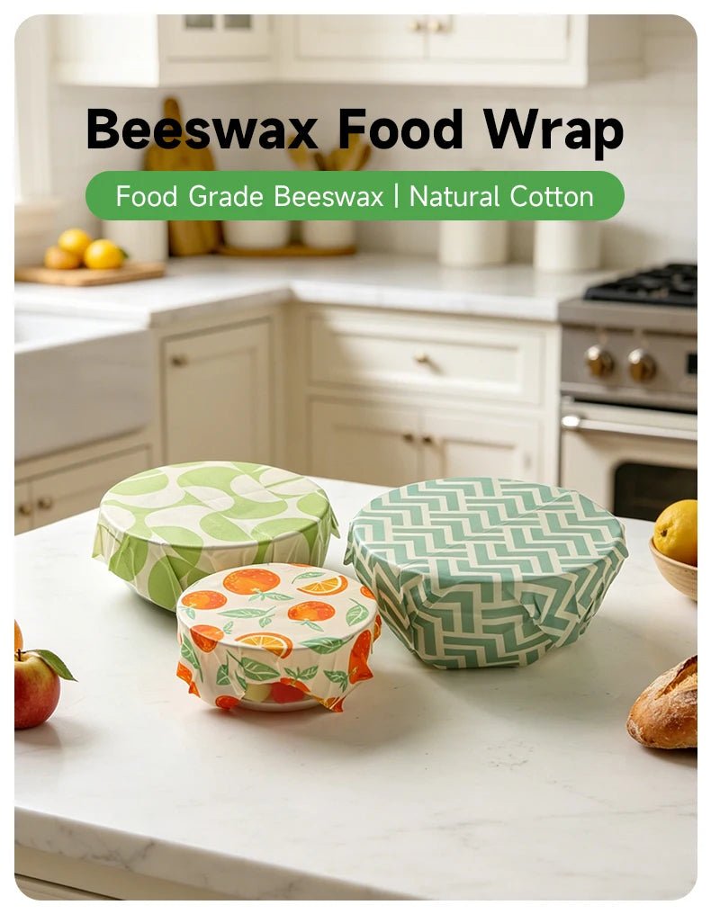 Reusable beeswax food wrap pack with teal zigzag and green fruit-pattern wraps