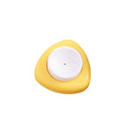 Egg hole puncher tool top view with white rim and yellow circular center
