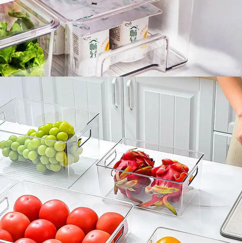 Clear stackable refrigerator bins with built-in handles holding grapes and sliced meat