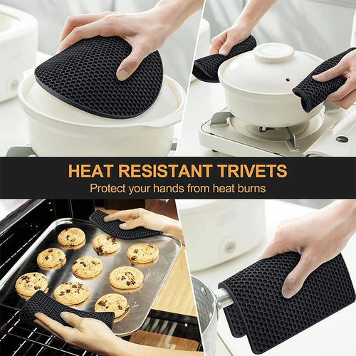 Black silicone hot pad and trivet set with honeycomb texture, used under cookware