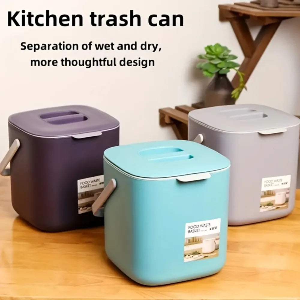 Countertop compost bins in dark purple, teal, and white with flip-up handles