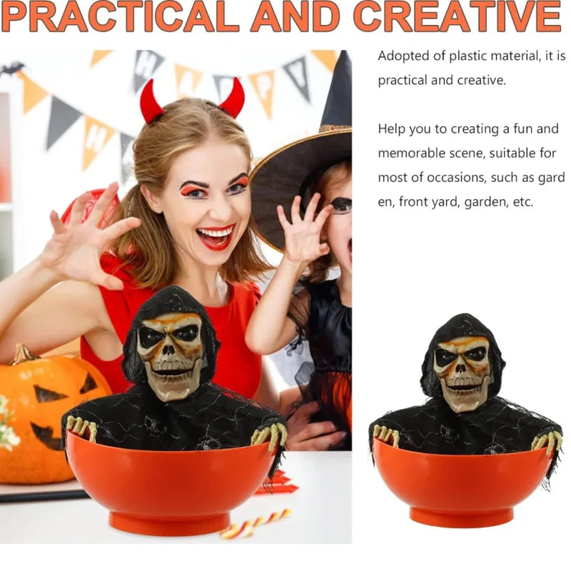 Orange skull bowl haunted prop with hooded skeleton face, showing front view