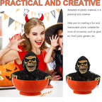 Orange skull bowl haunted prop with hooded skeleton face, showing front view