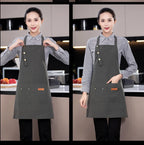 Gray canvas chef apron with neck tie, button placket, and front pocket