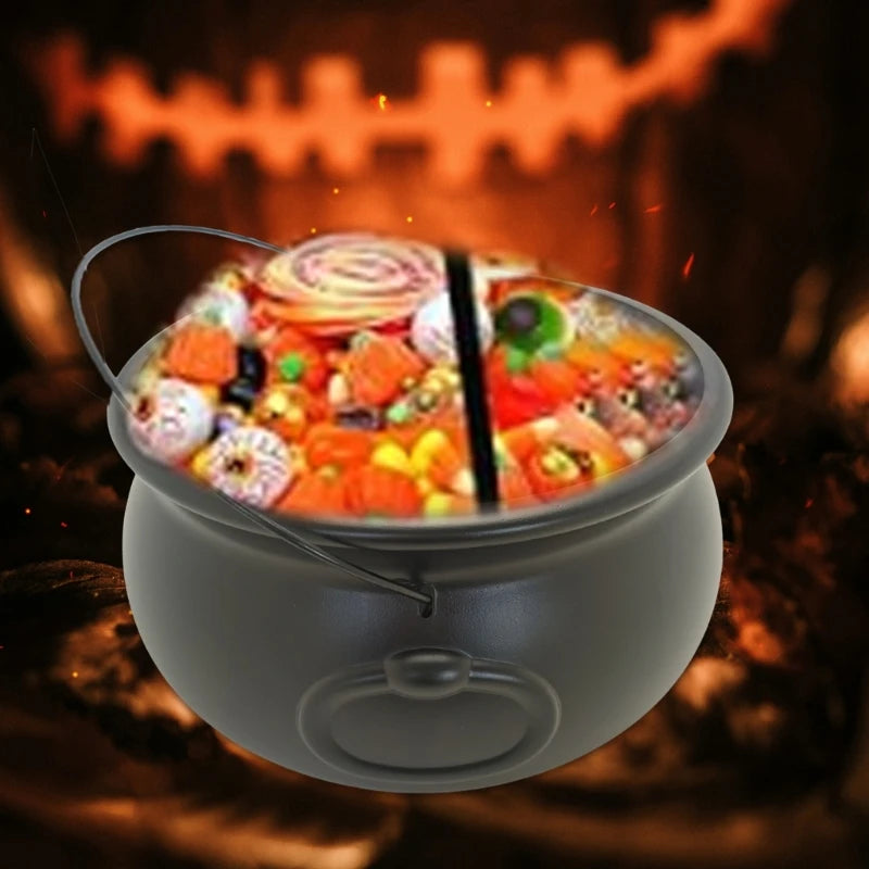 Black cauldron candy bucket holding assorted Halloween sweets, with hanging hook