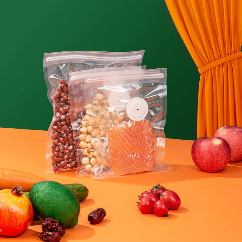 Reusable vacuum sealer food bags with valves, filled with dried ingredients and produce