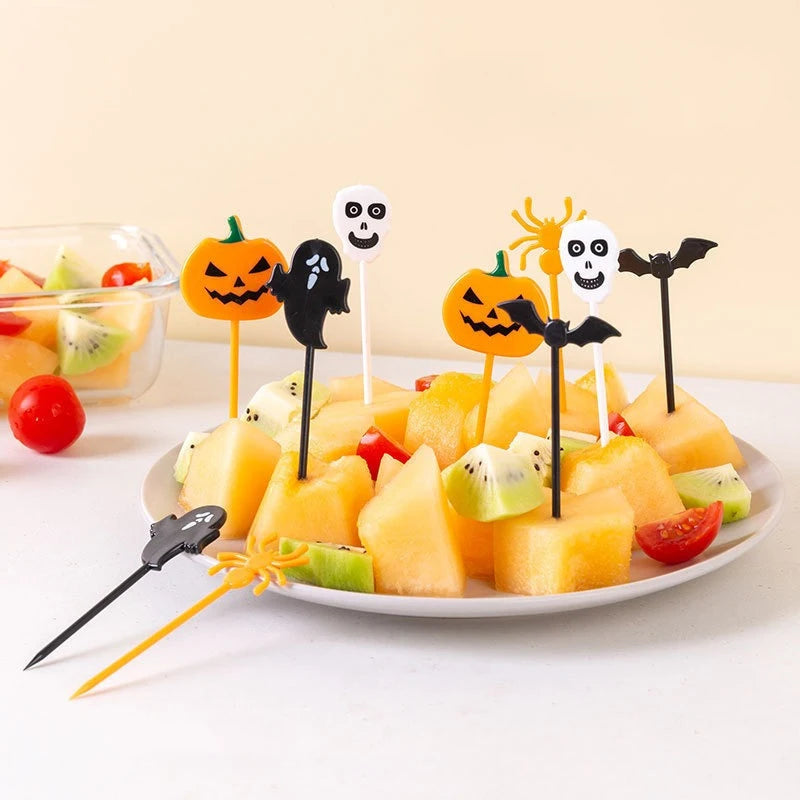Plastic Halloween cupcake toppers set of 10 with spooky icons on sticks in fruit salad