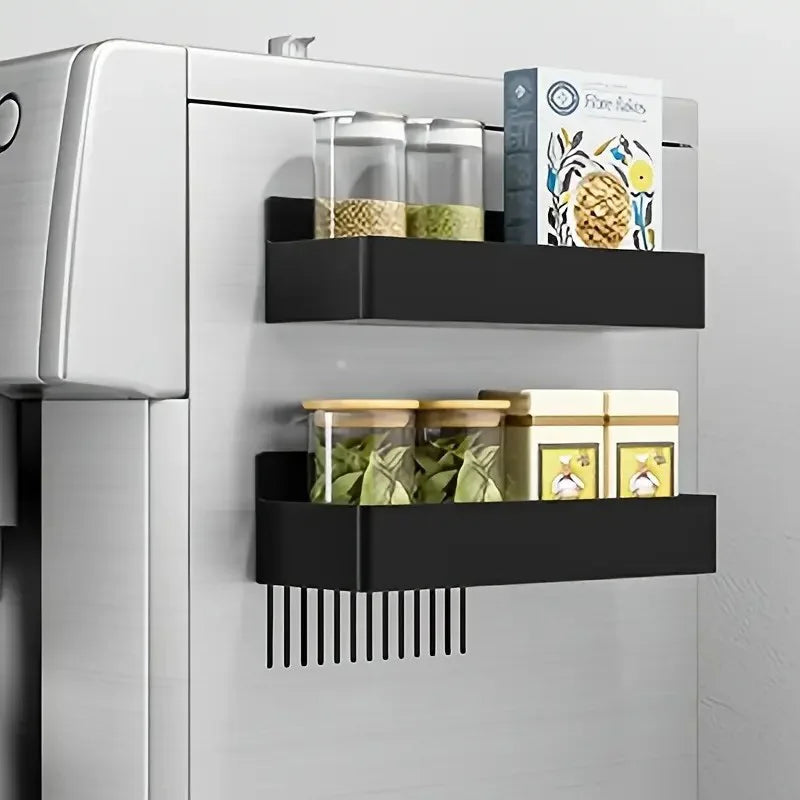 Black magnetic refrigerator storage basket with hooks mounted on white fridge