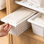 White under-sink storage basket with perforated side panels and front access