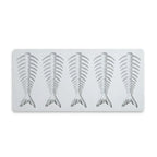 Gray silicone mold with four fish skeleton fishbone shapes on white background.