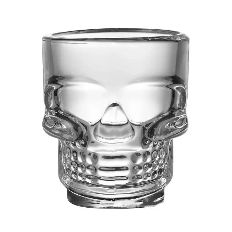 Skull head shot glass in clear glass with raised skull face, round rim