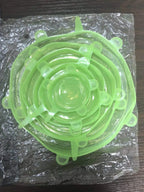 Reusable silicone stretch lids set in mint green, stackable circular lids with pull tabs