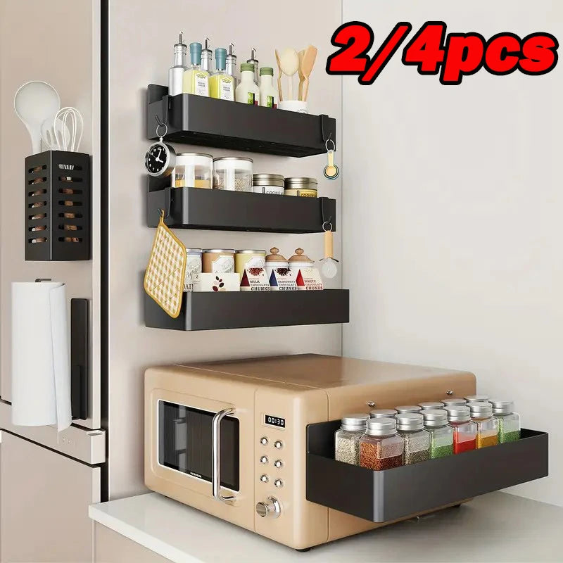 Set of black magnetic refrigerator storage baskets mounted on fridge door