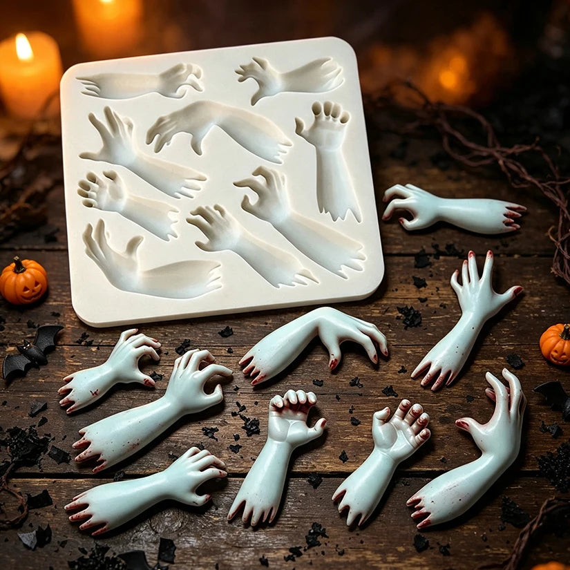 Rectangular silicone Halloween mold showing hand and arm cavities and molded pieces